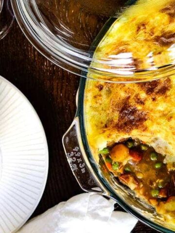 A lamb shepherd's pie served in a glass dish.