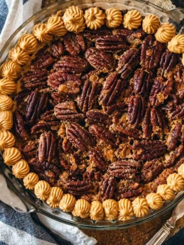 close up of pecan pie with dulce de leche cream.