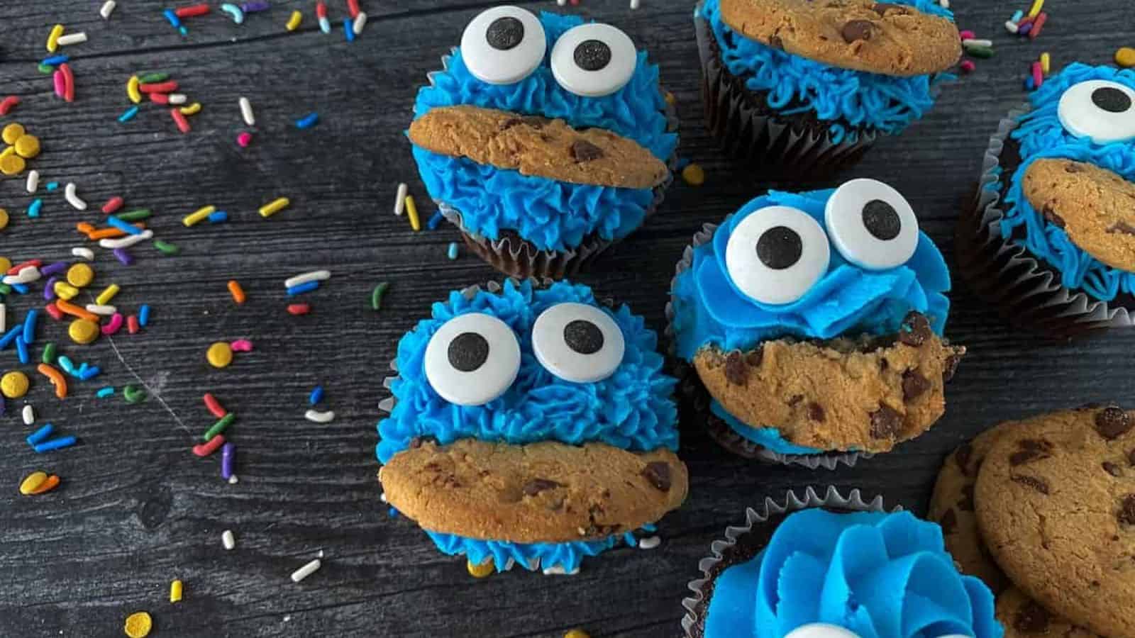 Cookie monster cupcakes with white and black eyes.