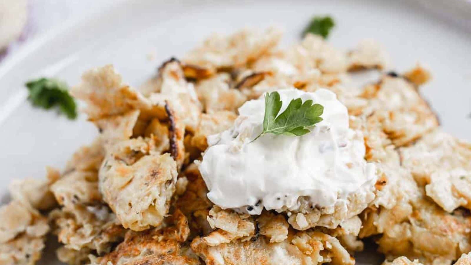 Matzo brei on two plates with parsely.