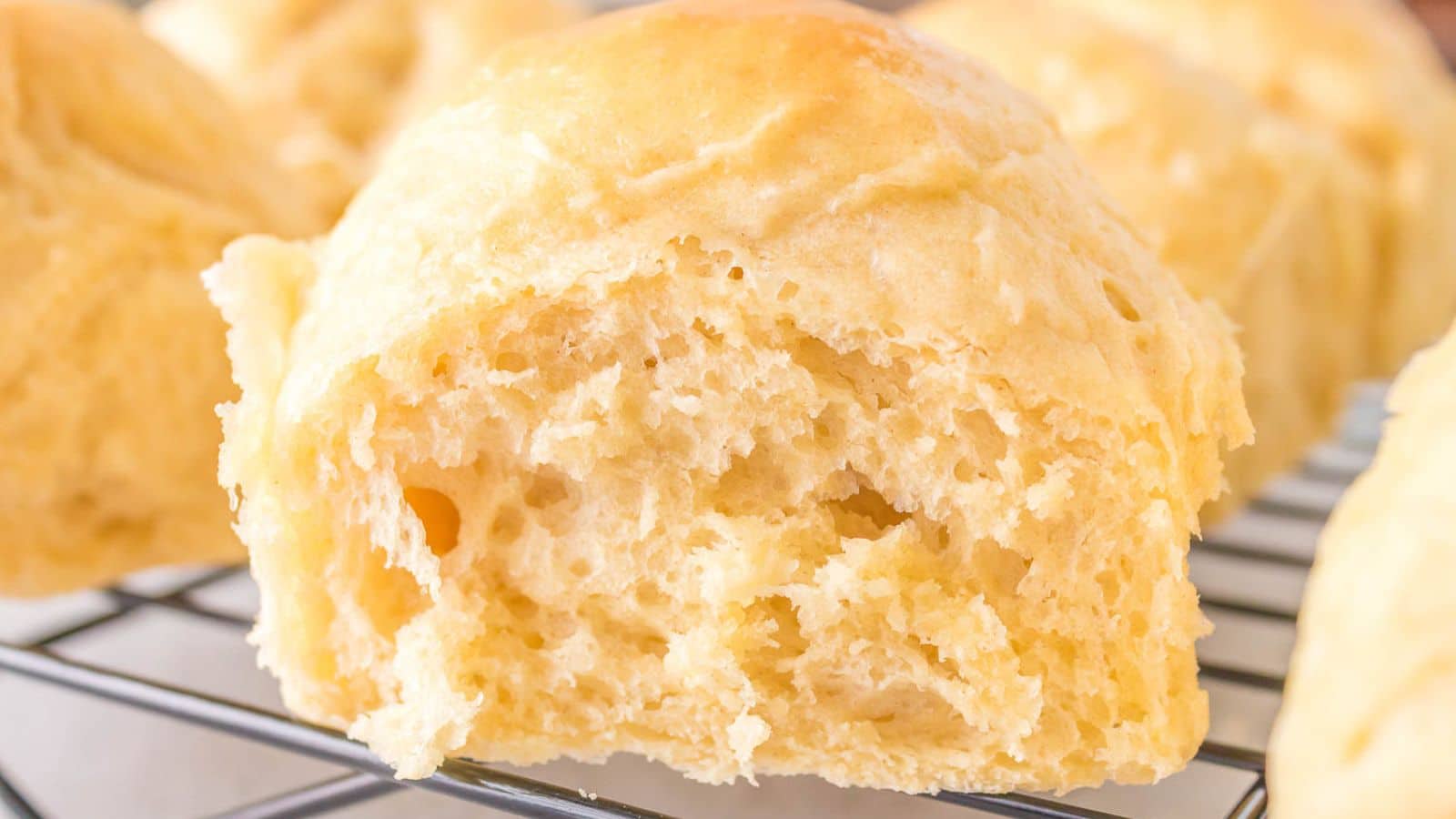Sourdough Dinner Rolls on a cooling rack.