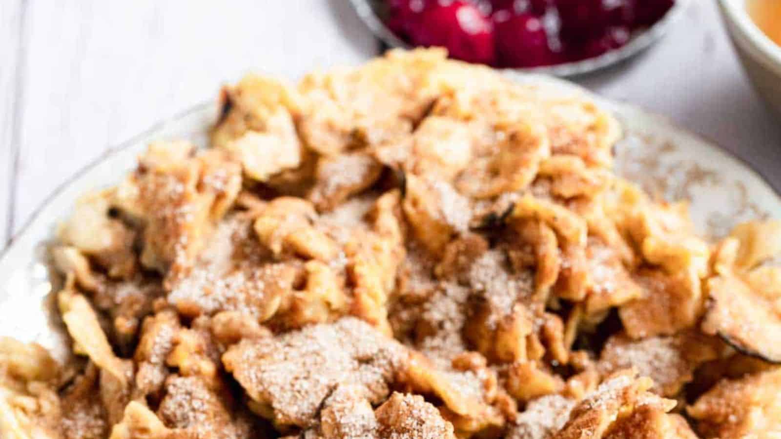 A plate with cinnamon toast and a cup of tea.