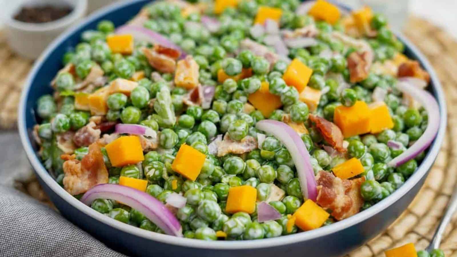 Pea salad in a blue bowl.