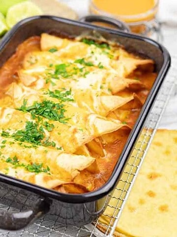A pan of baked chicken enchiladas casserole.