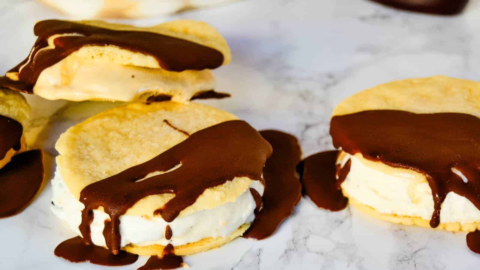 Ice cream sandwiches with chocolate drizzle.