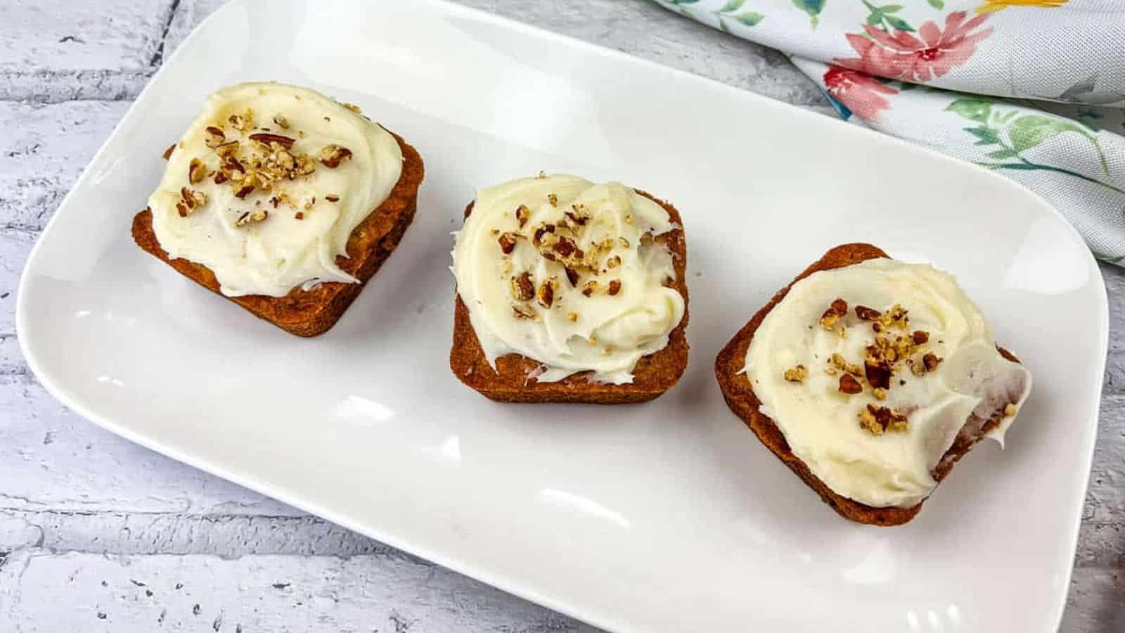 Three mini hummingbird cake on a white plate.