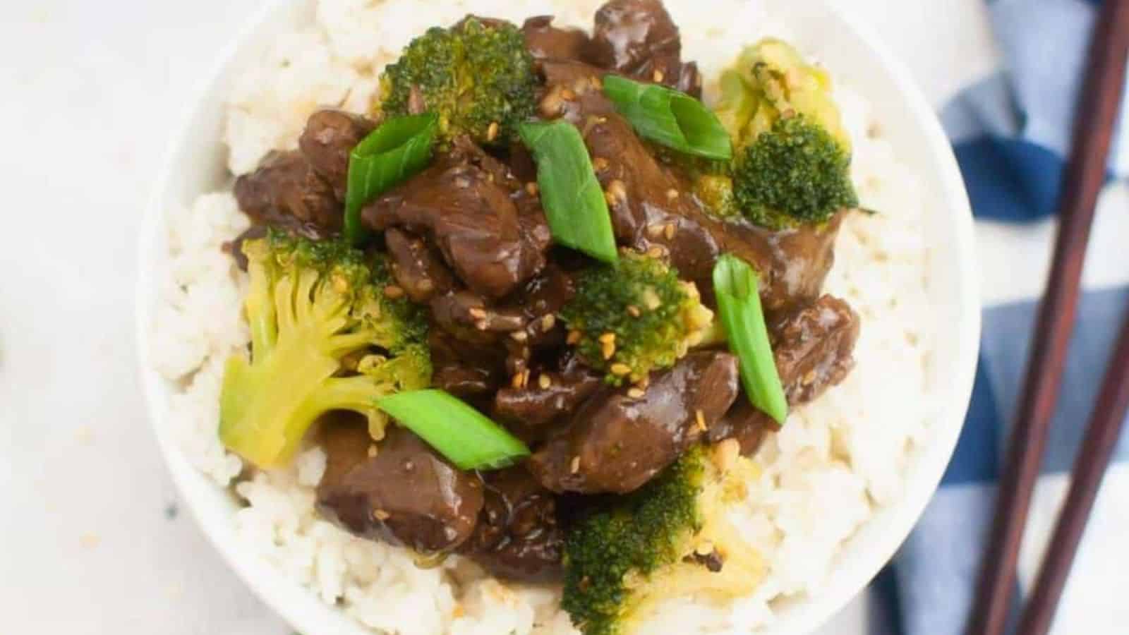 Teriyaki beef served on top of a bed of white rice.