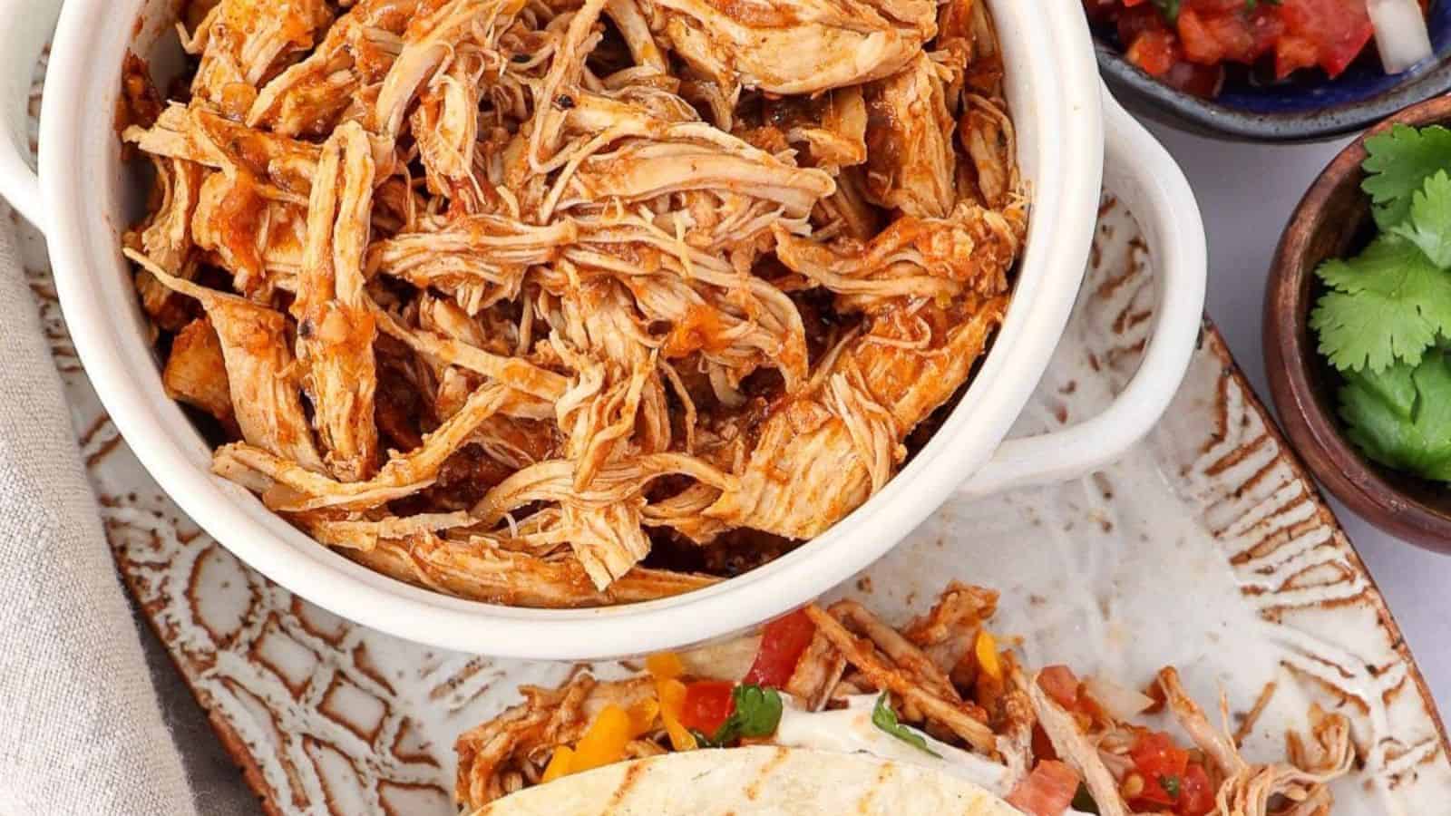 Slow-cooked chicken tacos in a crockpot.