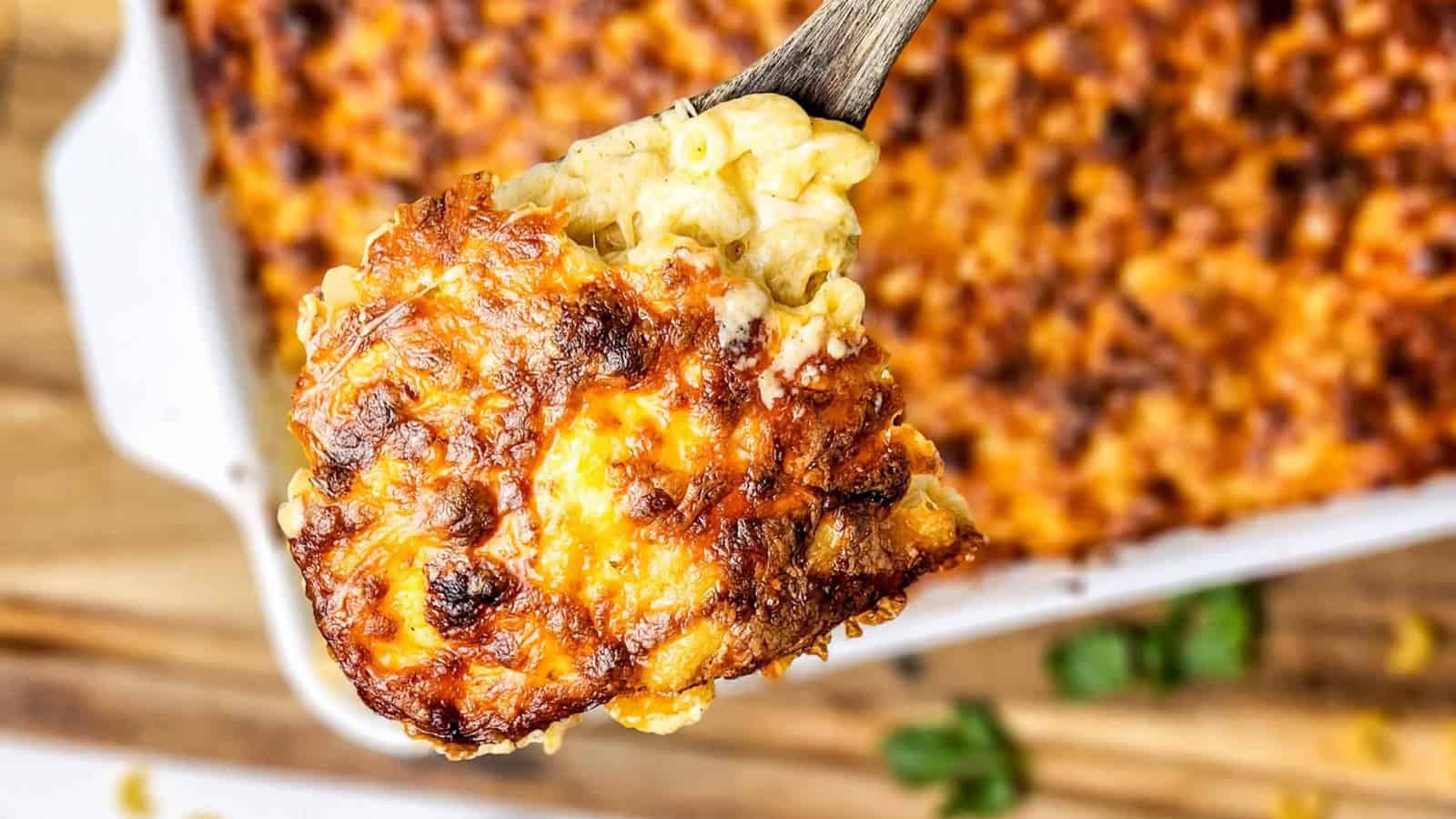 Baked four-cheese macaroni in a rectangular white casserole dish.