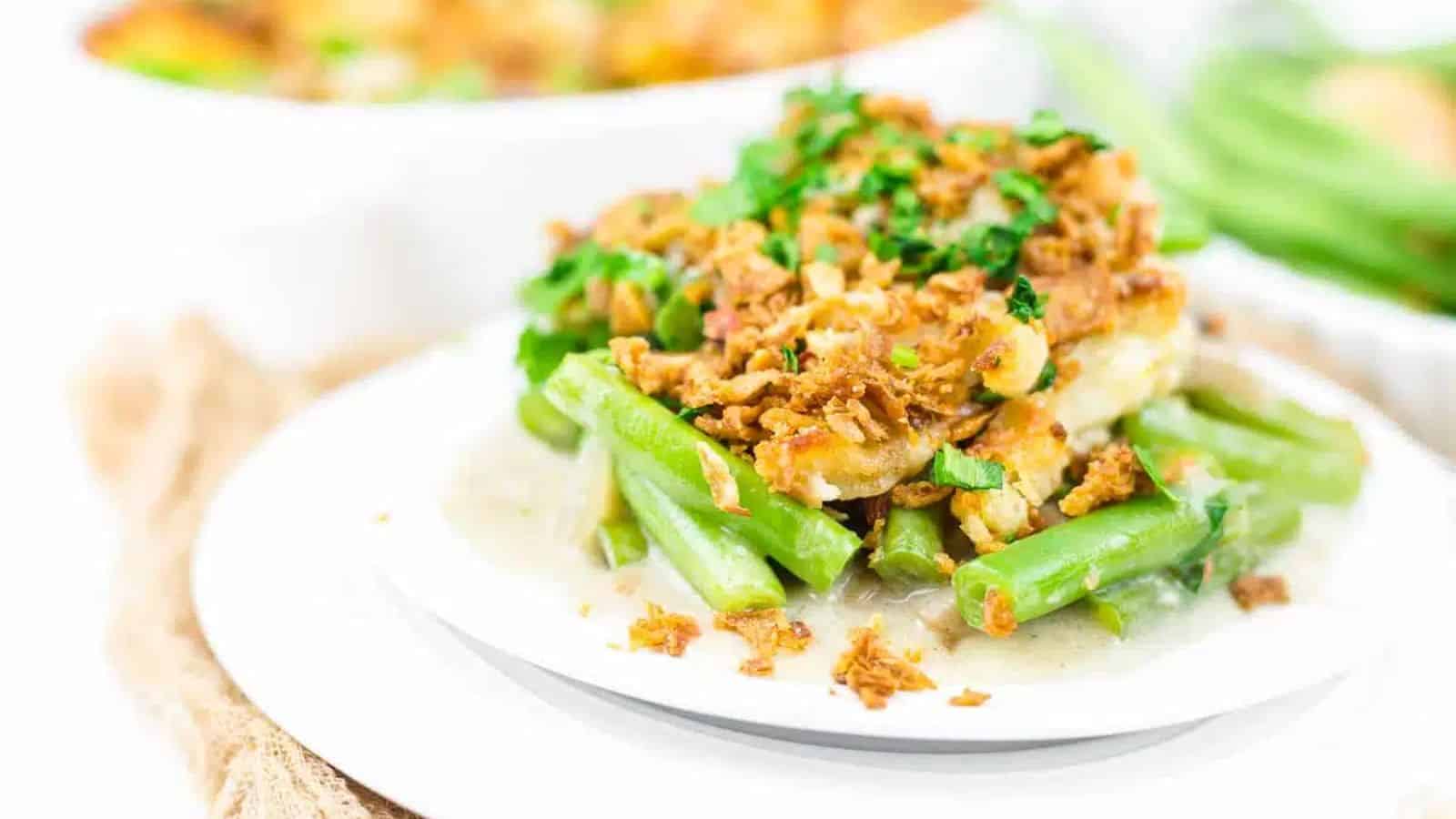 A plate of green bean mushroom casserole with fried onions.