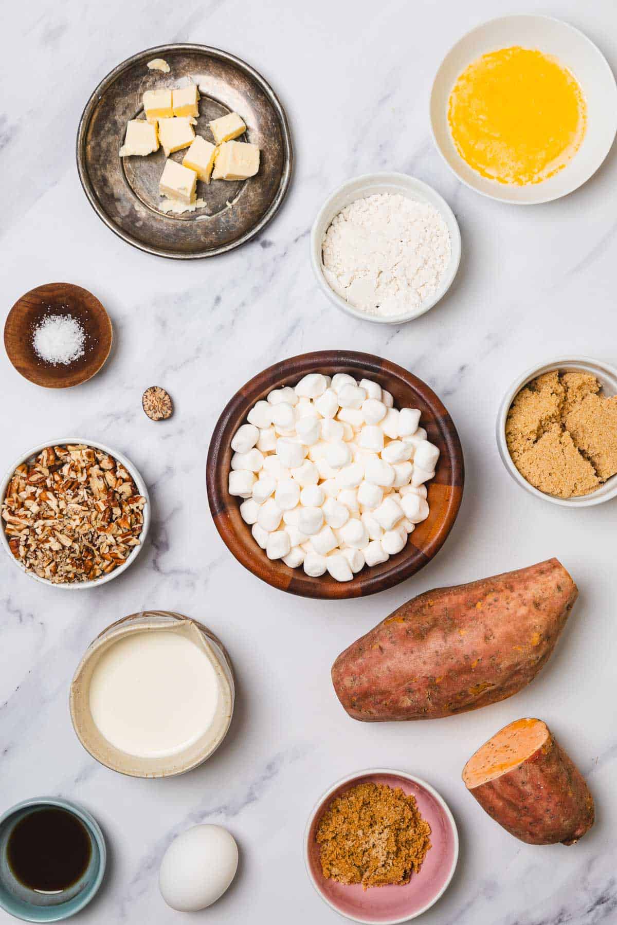 Discover the classic Sweet Potato Casserole with marshmallows, featuring sweet potatoes, marshmallows, nuts, egg, flour, and brown sugar for a deliciously comforting side dish.