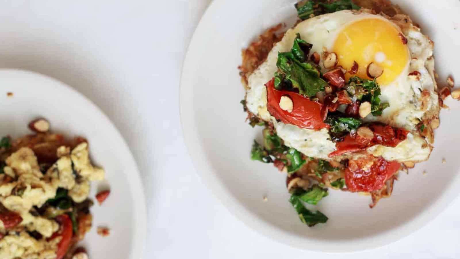 A plate topped with a fried egg and greens.