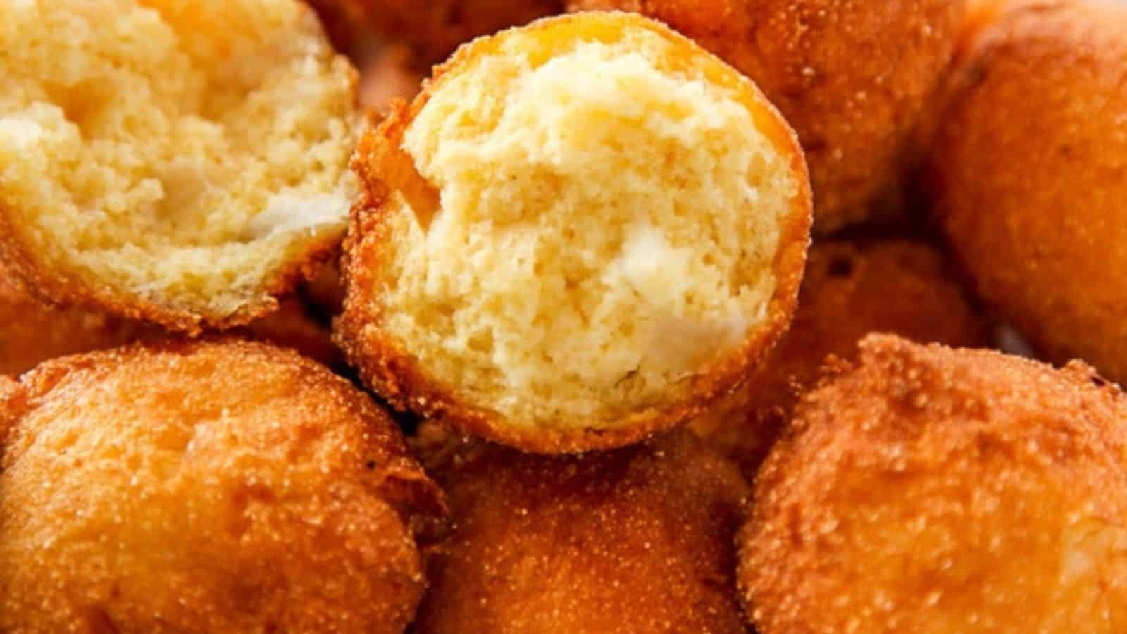 A basket of hushpuppies lined with a paper towel.