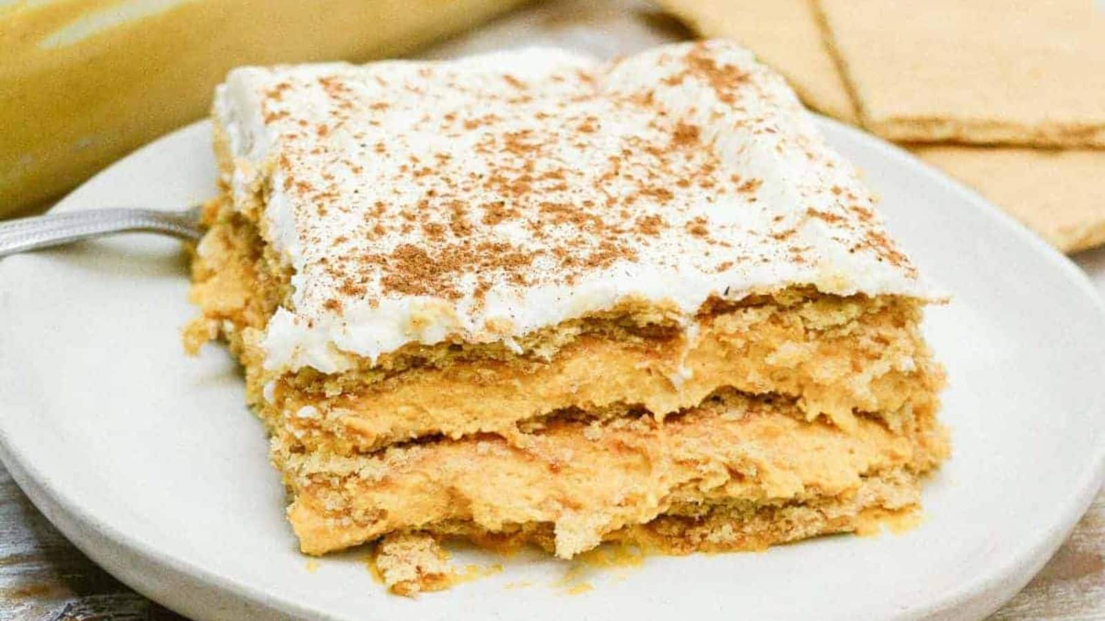 A piece of no-bake pumpkin icebox cake on a white plate.