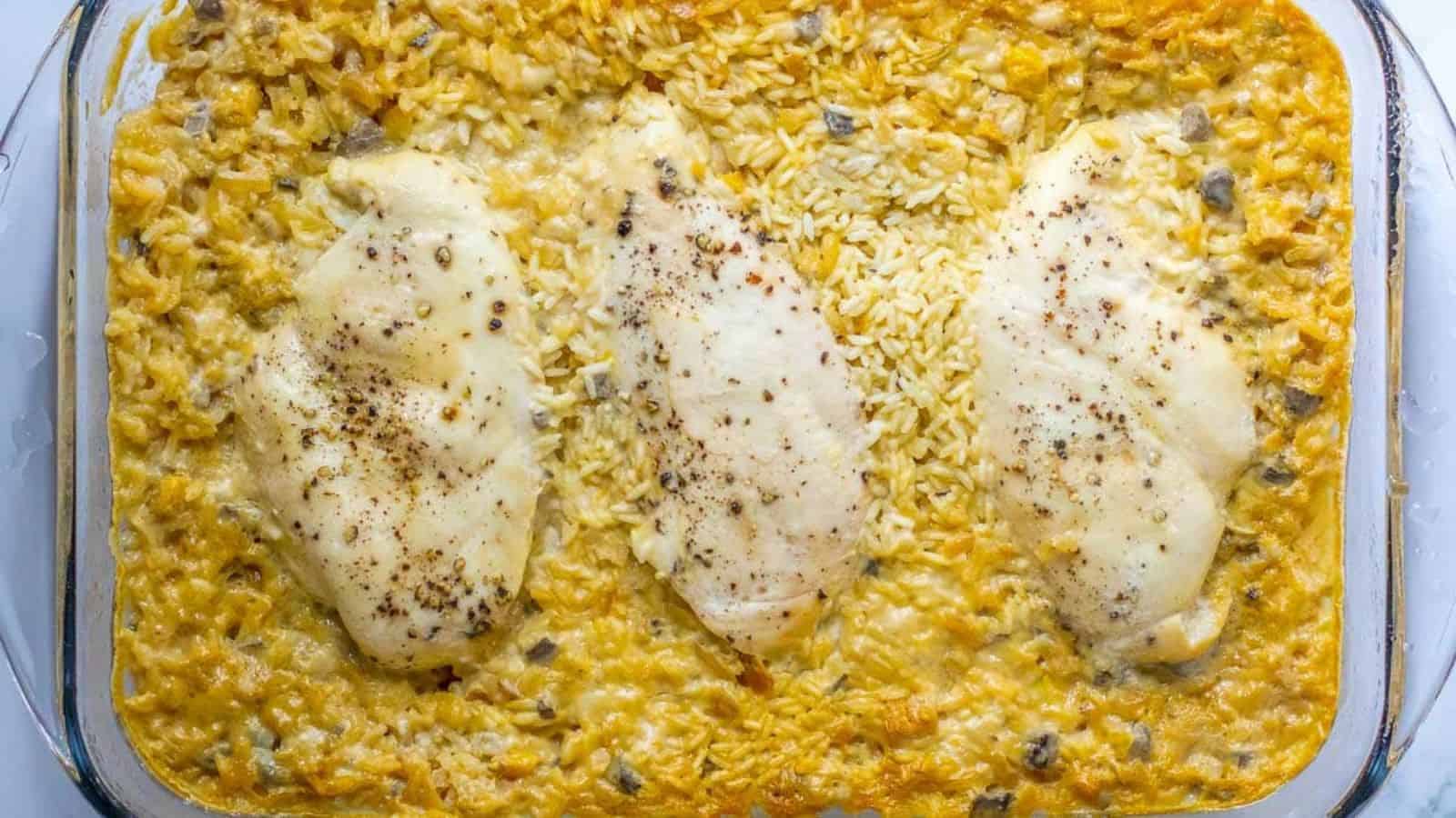 A casserole dish with chicken and rice in it.