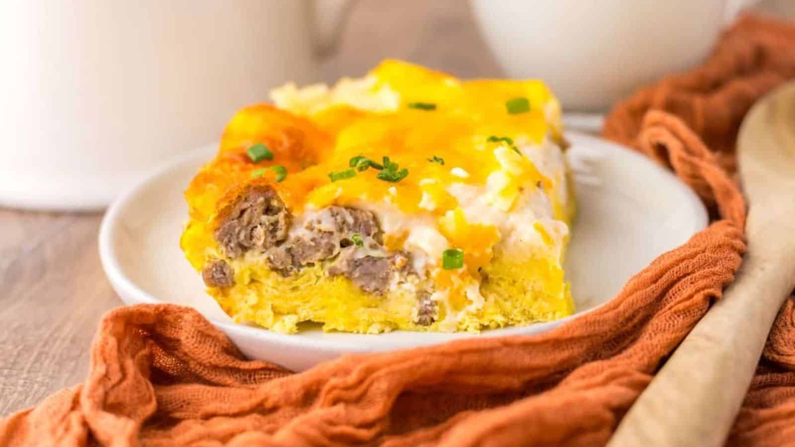 A close-up of two slices of a savory breakfast casserole.