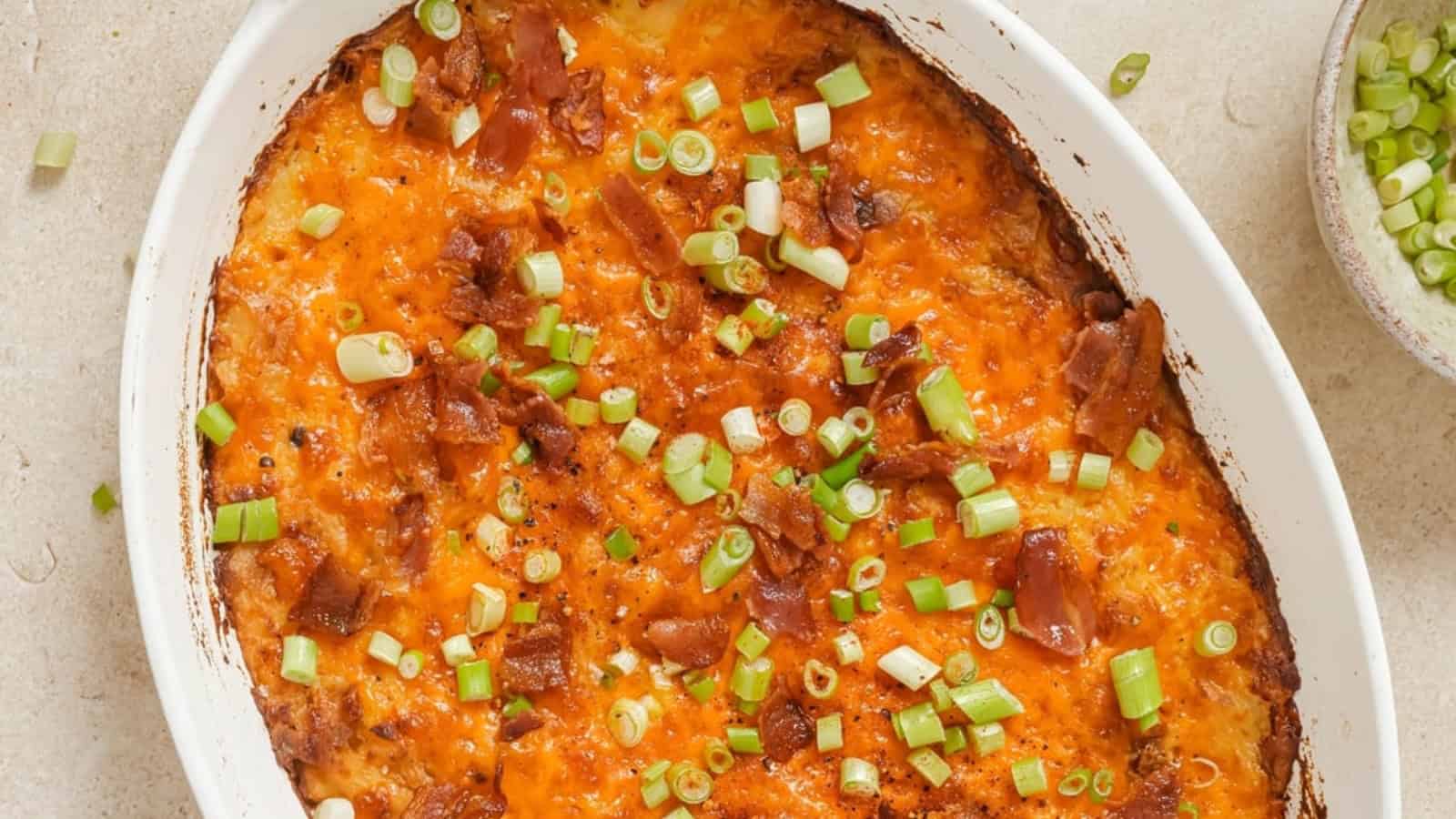 Twice baked potato casserole with bacon and green onions.