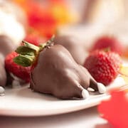 A fun Thanksgiving treat, this chocolate-covered strawberry is shaped like a turkey drumstick, complete with white candy "bones," bringing festive flair to your holiday table.