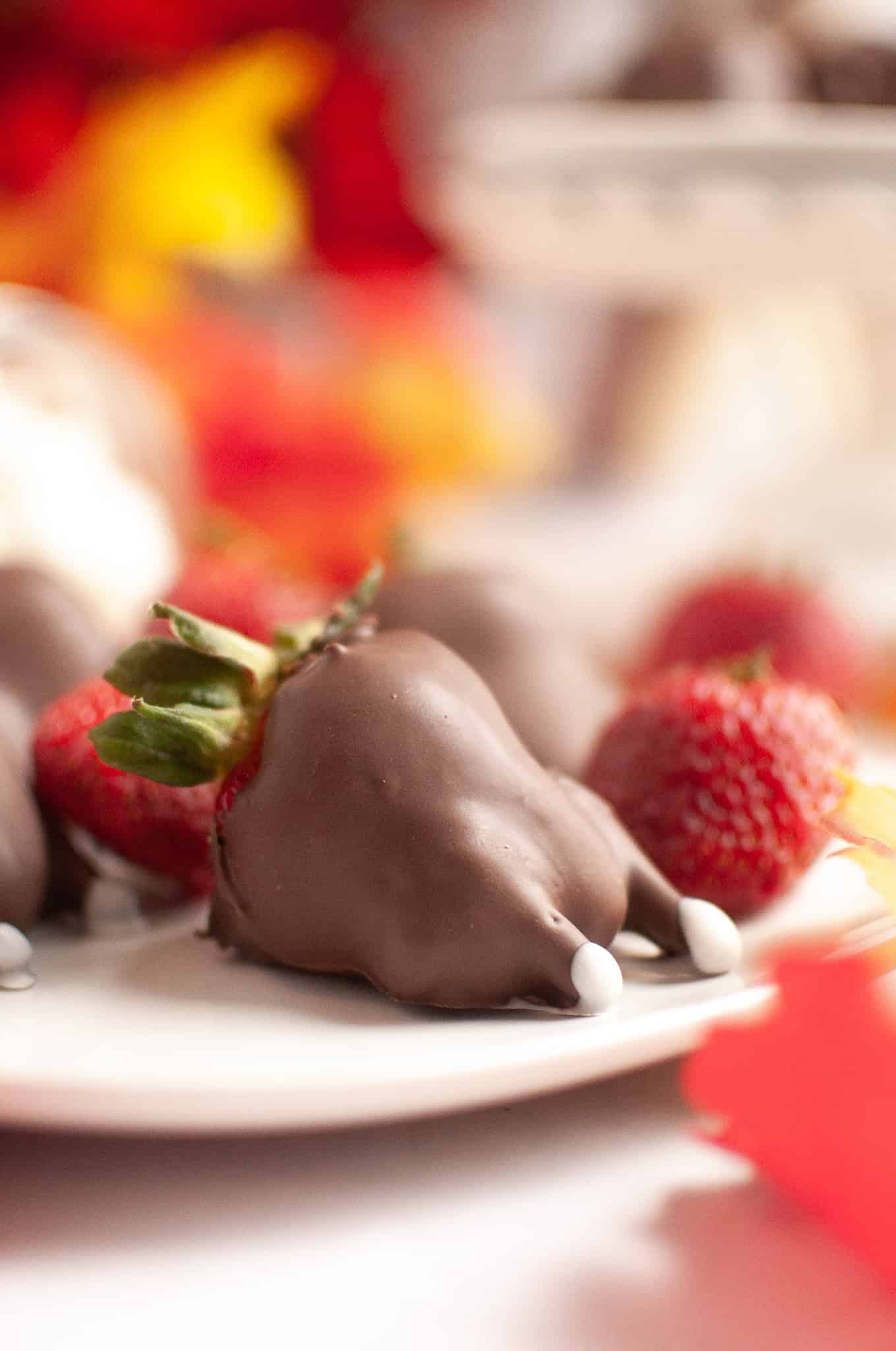 A fun Thanksgiving treat, this chocolate-covered strawberry is shaped like a turkey drumstick, complete with white candy "bones," bringing festive flair to your holiday table.