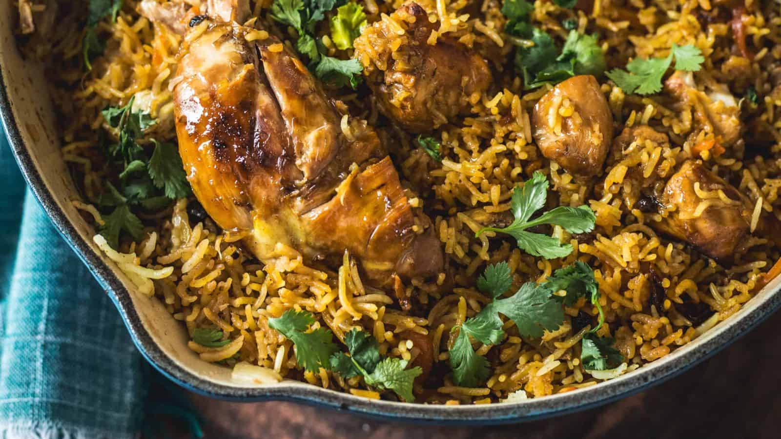 Chicken plov on a plate with a fork.