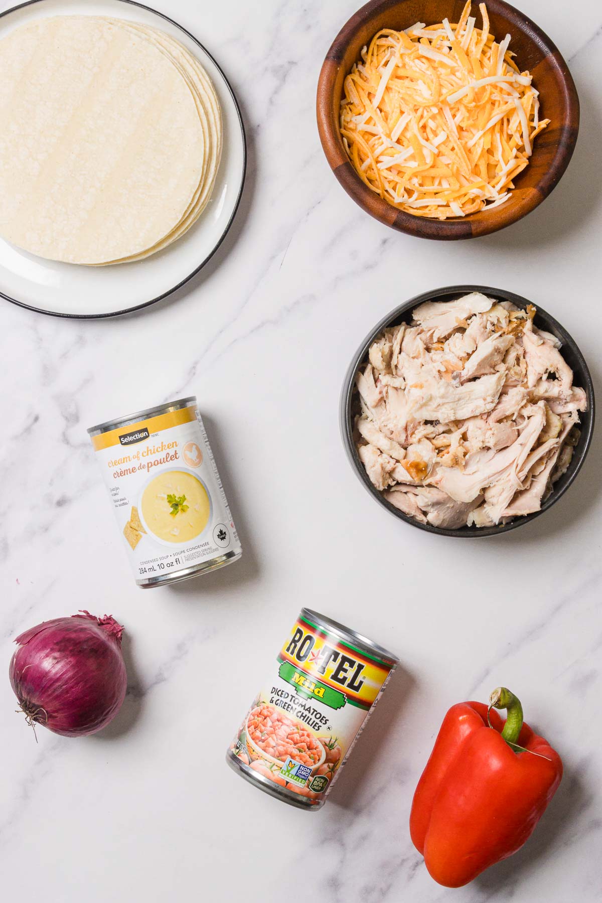 Flour tortillas, shredded cheese, cooked chicken, cream of chicken soup, Rotel, red onion, and red bell pepper come together in this classic King Ranch Chicken casserole.