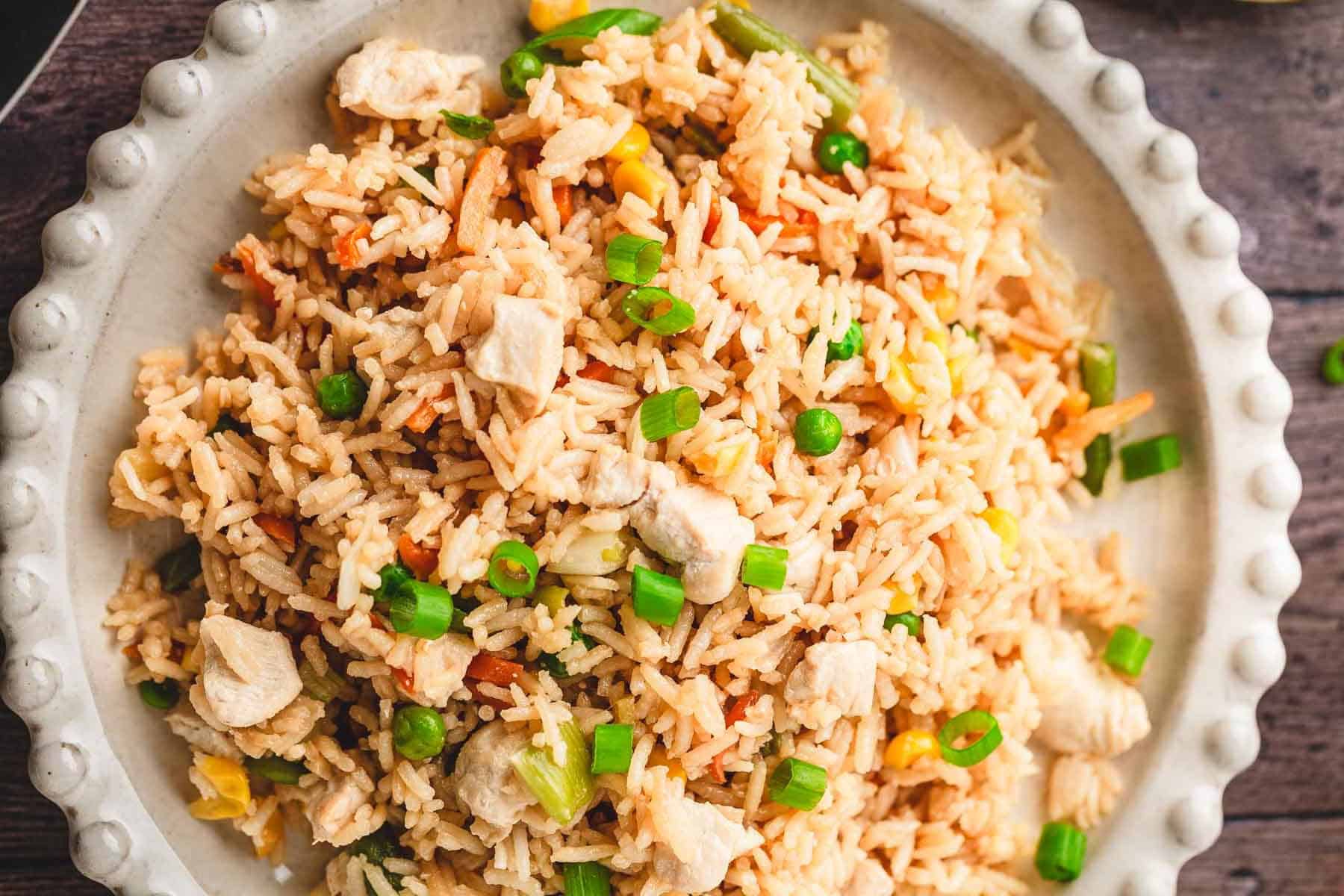 A plate of fried rice with peas, corn, carrots, and chopped green onions&mdash;perfect as a side or main dish. Try this recipe with Teriyaki Chicken for a delicious meal combo.