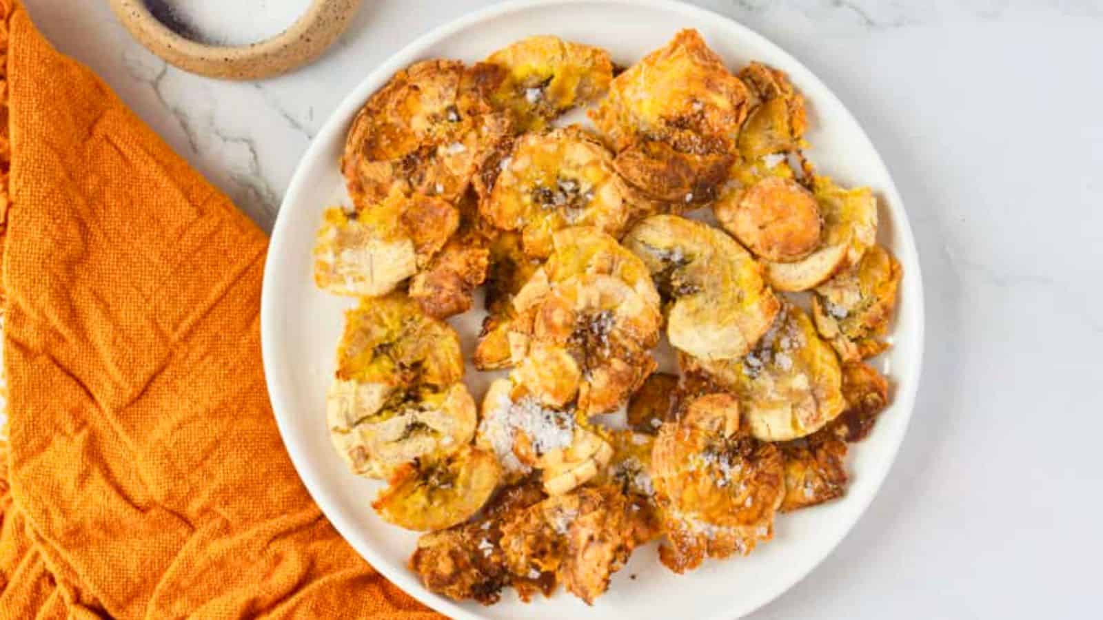 Overhead view of tostones with salt.