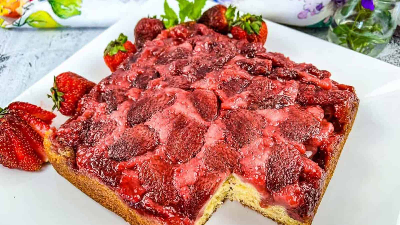 Strawberry Upside Down Cake with a slice missing.