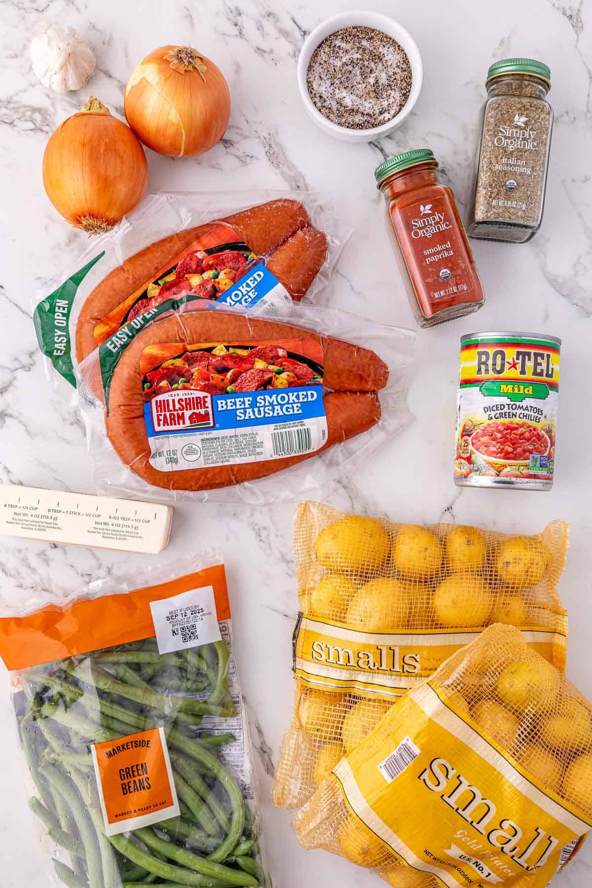 A hearty mix of smoked sausage and potatoes, onions, spices, green beans, canned tomatoes, and yellow potatoes&mdash;perfect for a cozy crockpot sausage dinner.