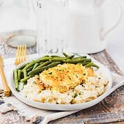 Copycat Longhorn Parmesan crusted chicken served with mashed potatoes and green beans.