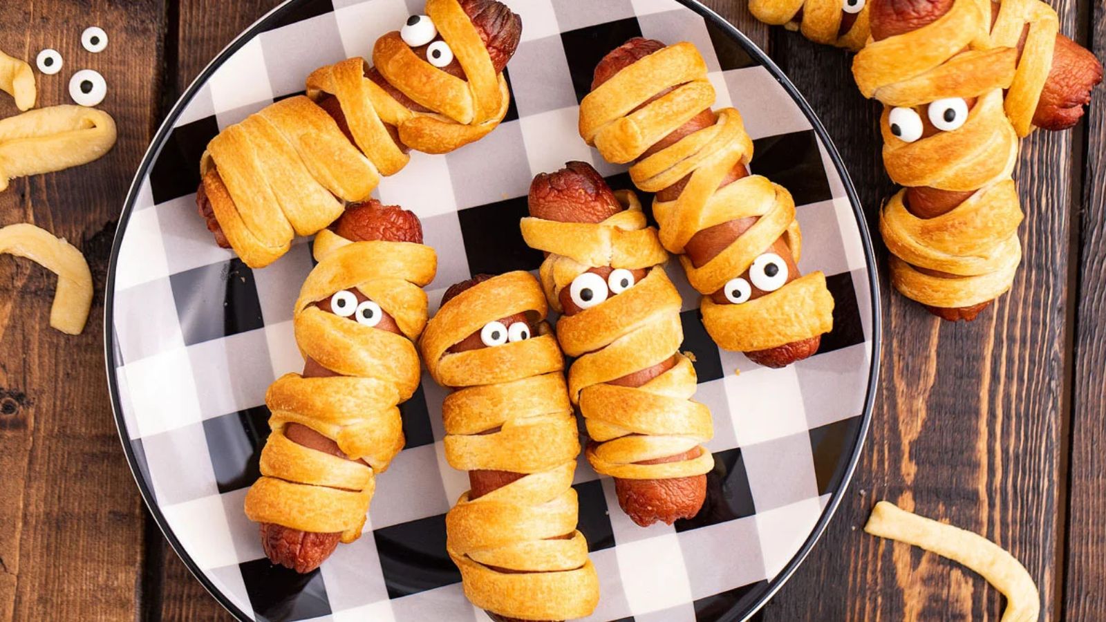 Mummy Halloween hot dogs wrapped in strips of pastry.