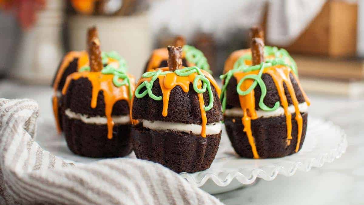 Pumpkin-shaped chocolate mini Bundt cakes with chocolate glaze.